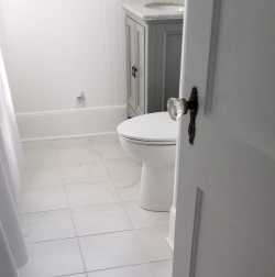 Bright bathroom with light tile flooring